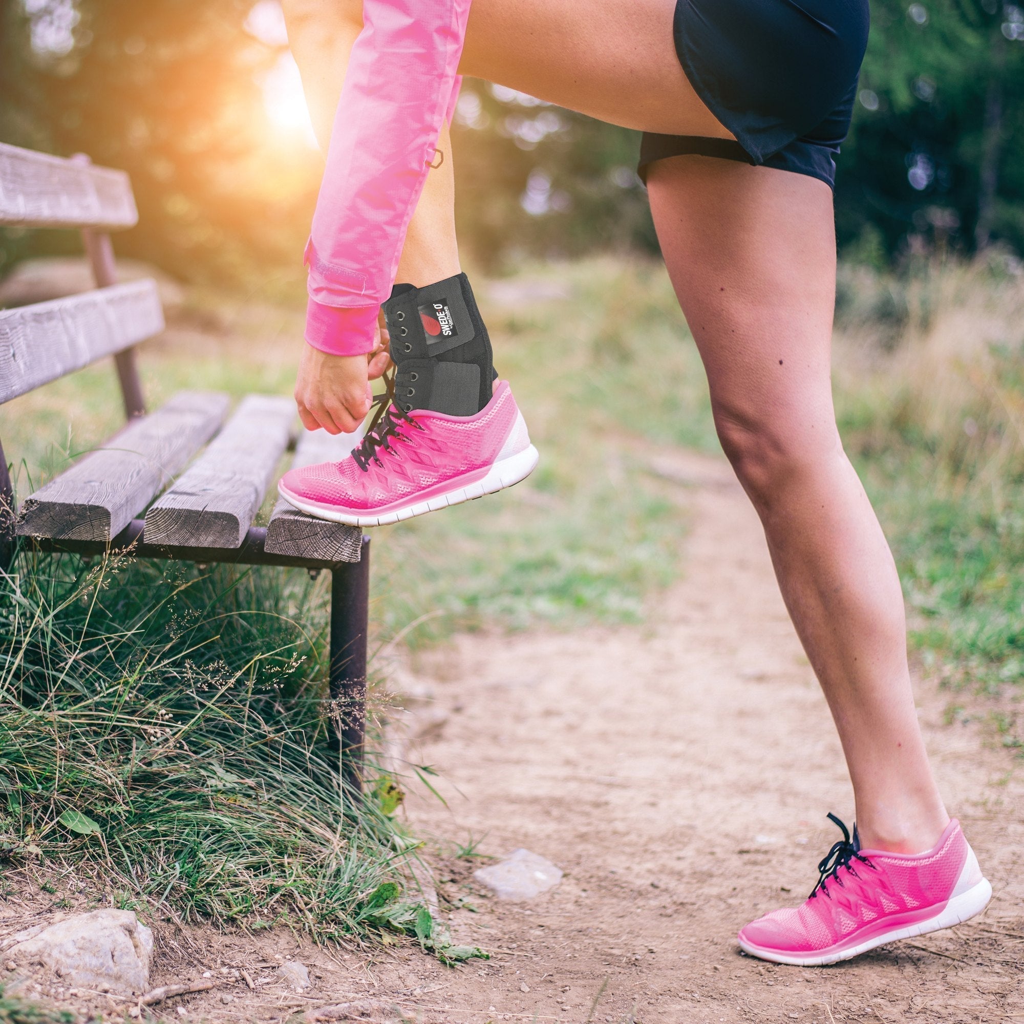 Swede-O PowerWrap ankle compression wrap worn on a park bench